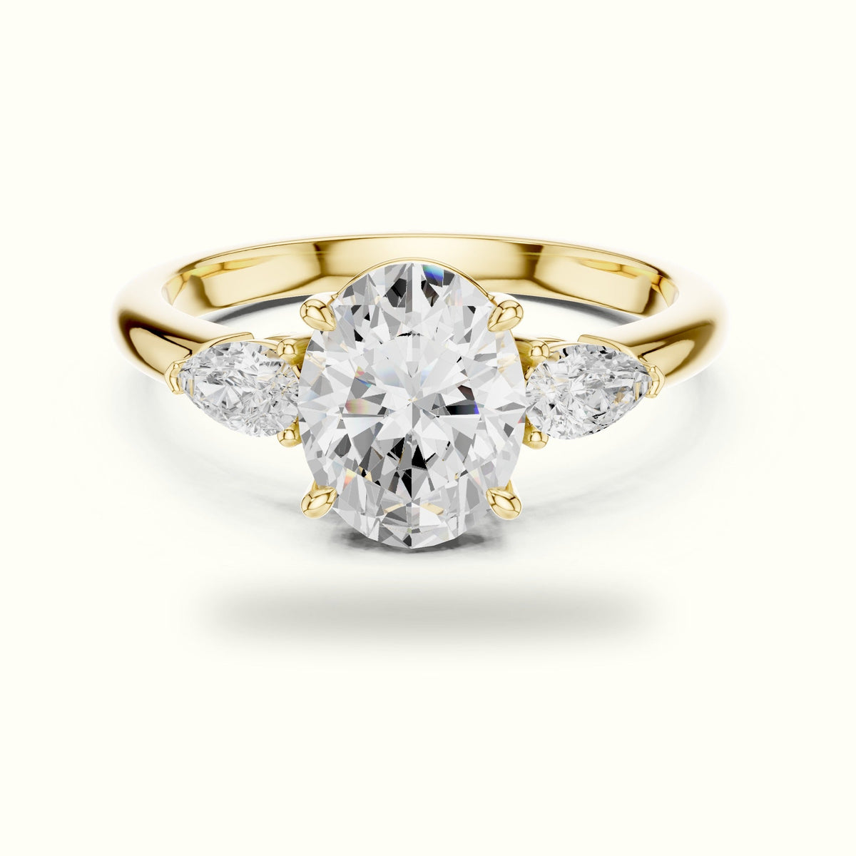 Oval Basket Lab-Grown Diamond Three Stone Ring — Yellow gold, front view | Crystal N Cuts
