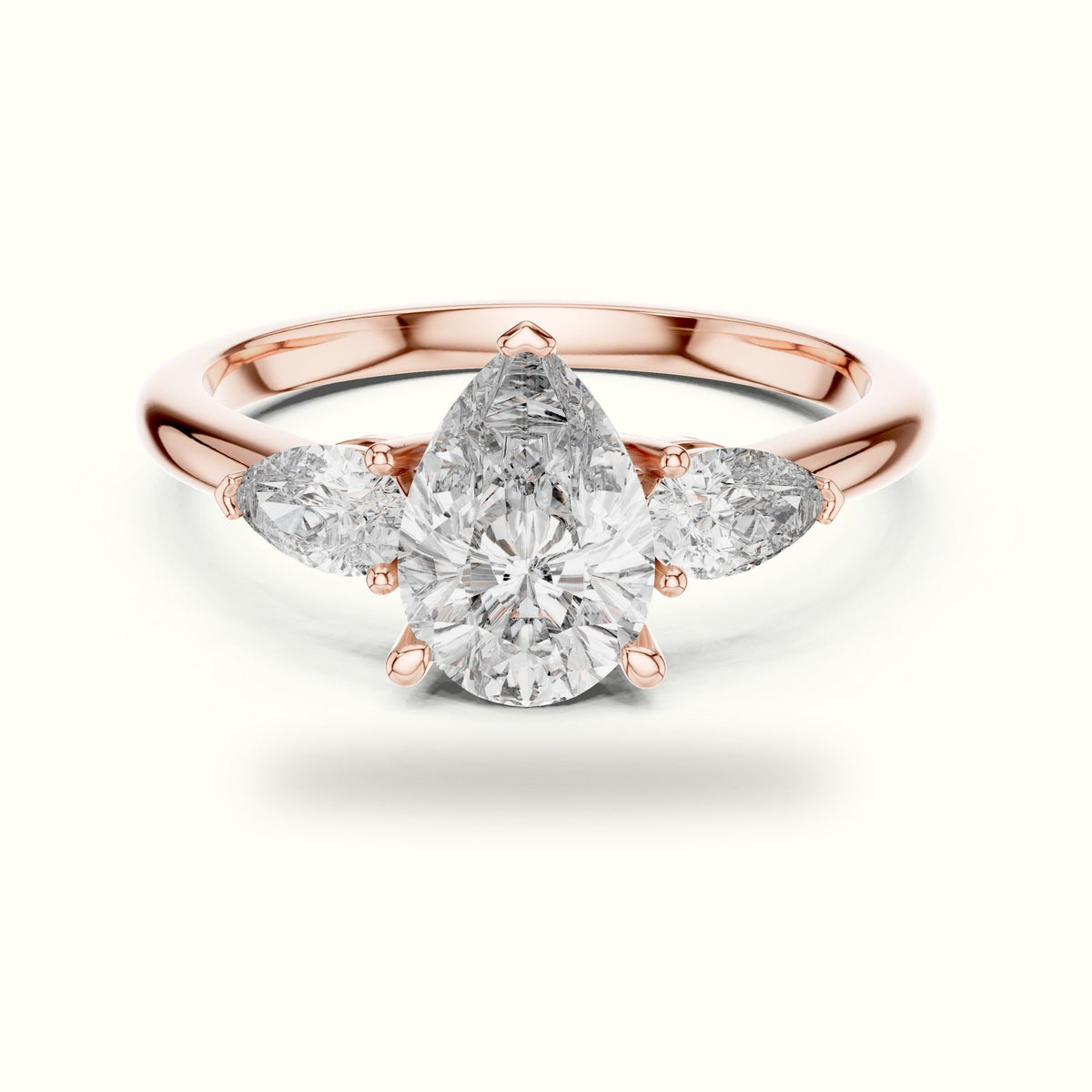 Pear Basket Lab-Grown Diamond Three Stone Ring — Rose gold, front view | Crystal N Cuts
