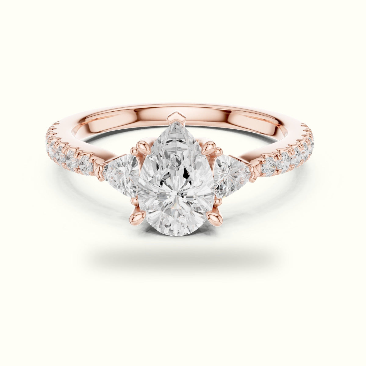 Pear Three-Stone with Accent Band Lab-Grown Diamond Ring — Rose gold, front view | Crystal N Cuts