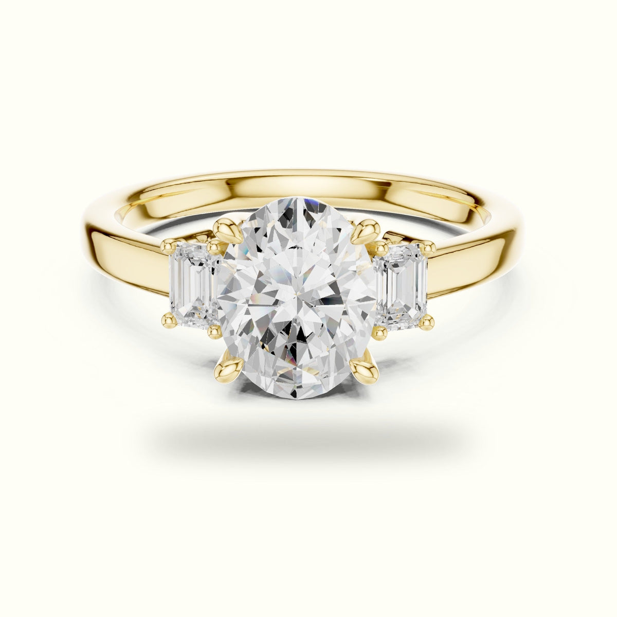 Oval Three-Stone Basket Lab-Grown Diamond Ring — Yellow gold, front view | Crystal N Cuts