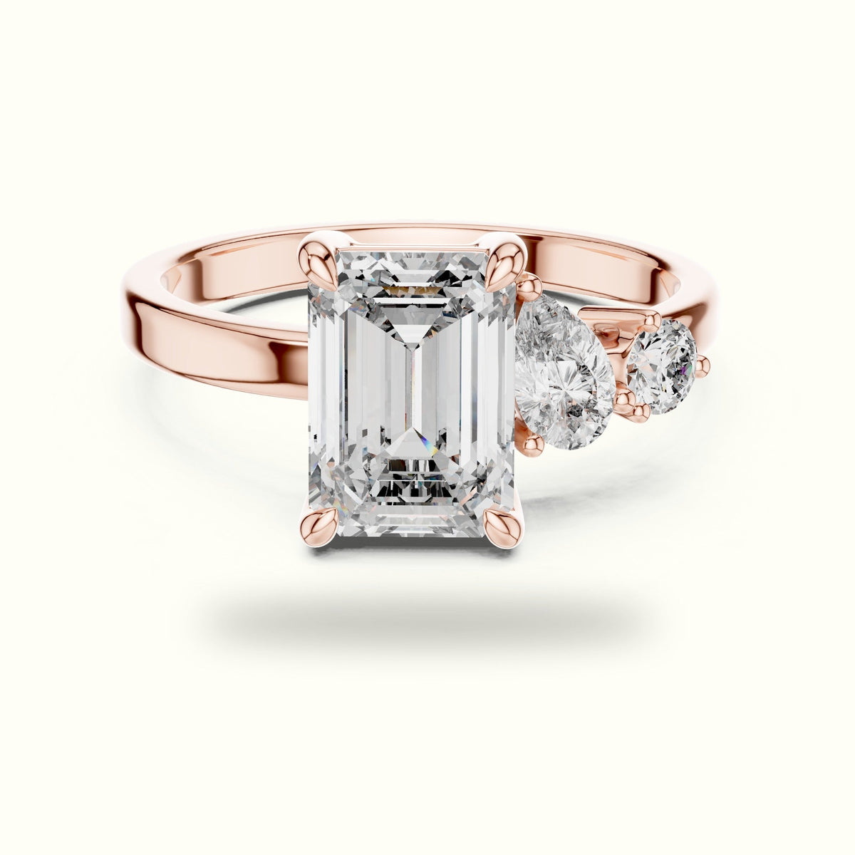 Emerald Side Stone Engagement Ring — Rose gold, front view | Crystal N Cuts