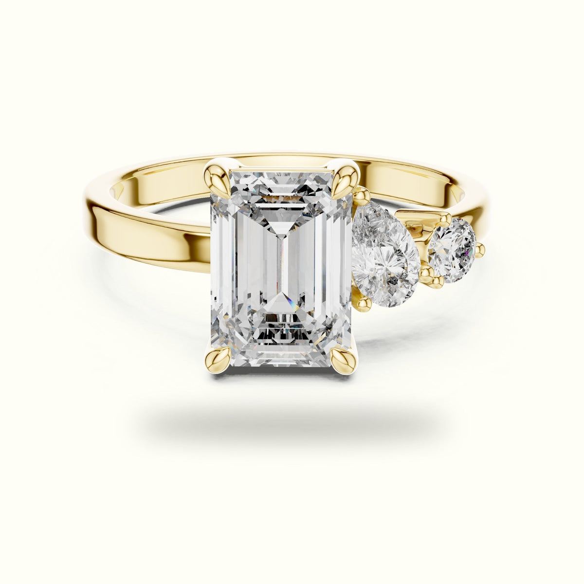 Emerald Side Stone Engagement Ring — Yellow gold, front view | Crystal N Cuts