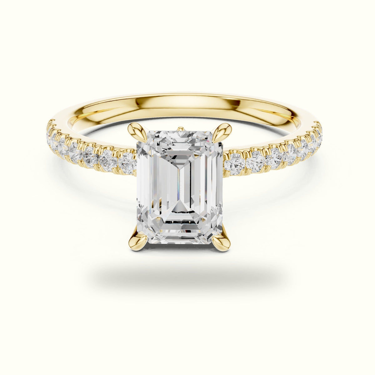 Emerald Cross-Over Hidden Halo Pavé Engagement Ring — Yellow gold, front view | Crystal N Cuts